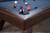 Doc & Holliday George Slate Pool Table in Antique Coffee, close-up view of the corner with colorful billiard balls on the blue felt surface.