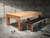 Doc & Holliday Paula Parsons Slate Pool Table, a wooden pool table with a sleek finish and a matching black cushioned bench in a modern, industrial-style room.