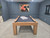 Doc & Holliday Paula Parsons Slate Pool Table, modern wood-finished pool table placed in a room with blue walls and abstract artwork.