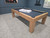 Doc & Holliday Paula Parsons Slate Pool Table, modern wooden pool table with black felt surface and sleek design, located in a game room with blue walls and a window.