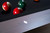 Doc & Holliday Bowie Pool Table in Glazed Pearl, close-up of the sleek, polished pearl surface with pool balls arranged on the black felt playing surface.