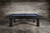 Doc & Holliday Zurich Pool Table | Dining Top Option, a modern black pool table with a sleek design and blue felt playing surface against a rustic wooden wall.