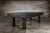 Doc & Holliday Zurich Pool Table, black modern pool table with dining top option, placed in an industrial-style room with a wooden wall background.