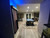 Doc & Holliday Zurich Pool Table | Dining Top Option, in a living room with wooden flooring, a patterned rug, and modern decor, featuring a pool table with blue felt surface as the main focus.