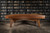Doc & Holliday Scholar Pool Table by Doc & Holliday, made in the USA, in a room with a dark wooden floor and a large bookshelf filled with books in the background.