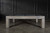 Doc & Holliday The Natural Slate Pool Table, modern pool table with natural slate surface, in a minimalist room with black paneled wall.