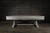 Doc & Holliday Hepburn Slate Pool Table, modern pool table with a sleek grey slate surface and sturdy wooden legs, set against a black brick wall background.