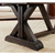 Playcraft Brazos River Pool Table, Playcraft Black, Sawyer Twain, close-up view of the dark stained wooden table leg with angled support beams and a rustic finish, placed on a beige rug in a living room.