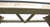Playcraft Brazos River Pool & Shuffleboard Combo – Weathered Grey, close-up of the wooden shuffleboard table's underside showing the sturdy wooden construction and support beams.