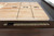 Plank & Hide Co Lana 14' Shuffleboard Table by Plank & Hide Co, showcasing a sleek wooden surface with numbered scoring spots and a modern brown finish.