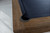 Brunswick Billiards Brunswick Soho Slate Pool Table, close-up of the table's corner showing the wooden frame and black felt surface.
