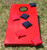 Sawyer Twain All Weather Outdoor Ultimate Cornhole, red cornhole game with nylon bags laid on a grassy surface.
