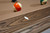 Brunswick Billiards Brunswick Glenwood Slate Pool Table in Coffee, close-up of the table's wooden edge and playing surface with billiard balls.