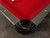 Doc & Holliday Denali Slate Pool Table in Rustic Charcoal with red felt top, black corner pocket, and wooden side panels.
