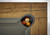 Brunswick Billiards Brunswick Parsons Pool Table in Natural Dry Oak, seen from above with a close-up of the corner pocket filled with cue balls.