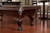 American Heritage Billiards Marietta 8' Slate Pool Table - Sierra Finish, detailed view showing the dark wood finish, ornate cabriole legs, and slate playing surface in a game room setting.