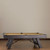 American Heritage Billiards American Heritage Savannah Slate Pool Table in Charcoal, side view of the pool table with dark wood finish and beige playing surface, against a plain wall.