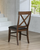 American Heritage Billiards Savannah Game Chair | Sable, a wooden game chair with a dark leather seat and cross-back design, placed indoors near a window.