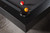 Doc & Holliday TRON Steel Slate Pool Table, close-up of the black cushioned corner and billiard balls on the playing surface.