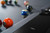 Doc & Holliday TRON Steel Slate Pool Table, close-up of the pool table with billiard balls arranged on the surface.