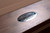 Doc & Holliday Derby Slate Pool Table, close-up of the metal brand badge on the wooden frame.