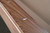 Doc & Holliday Derby Slate Pool Table, made in USA, featuring a close-up of the wooden frame with a small mother-of-pearl inlay.