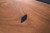 Doc & Holliday Muse Pool Table, close-up view of the wooden surface with a black inlay detail.