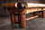 Doc & Holliday Woodslee Slate Pool Table, rustic wooden pool table with natural wood finish, sturdy log legs, and ornate leather pockets.