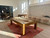 Brunswick Billiards Brunswick Parsons Pool Table & Shuffleboard Combo, indoor game room with pool cues on the table and seating area with stools.