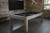 Brunswick Billiards Brunswick Sanibel Pool Table & Shuffleboard Table, modern game room with rustic wood pool and shuffleboard table against exposed brick wall.