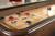 Brunswick Billiards Brunswick Concord Shuffleboard with Split-Playfield, tabletop game featuring numbered scoring zones and pucks.
