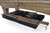 Brunswick Billiards Brunswick Billiard Table Storage Drawer, showing containing pool cues, a tray, and a box of pocket balls underneath a wooden billiard table.
