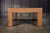 Doc & Holliday Parsons Pool Table in Rustic White Oak, showcasing a sturdy wooden frame with elegant natural wood grain finish set against a dark paneled wall.