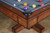 Close-up view of the Doc & Holliday Caroline's top-quality 1-inch thick slate and choice of premium felt colors. This image emphasizes the table's exceptional craftsmanship and the smooth, flawless playing surface that promises optimal playability. Close-up view of the Doc & Holliday Caroline's top-quality 1-inch thick slate and choice of premium felt colors. This image emphasizes the table's exceptional craftsmanship and the smooth, flawless playing surface that promises optimal playability.