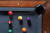 Doc & Holliday Caroline Slate Pool Table, top corner view showing pool balls on blue felt with corner pocket and wood frame.