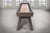 Doc & Holliday George Shuffleboard Table - Glazed Pearl Finish, modern shuffleboard table with wooden surface and angled legs in a spacious room with large windows.