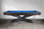 Doc & Holliday Jett Stealth Steel Slate Pool Table – USA Made, modern pool table with blue felt, dark wood finish and unique black X-shaped legs.