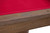 Plank & Hide Covington Slate Pool Table, close-up of the wooden frame with a metal plaque engraved with the brand name. The table has a red felt surface.