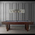 American Heritage Billiards Abbey 8' Slate Pool Table in Espresso, showcasing a sleek wooden design with a dark espresso finish, placed against a modern gray-paneled wall with a stylish light fixture above.