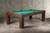 Doc & Holliday Paula Parsons Pool Table in Antique Coffee, wooden pool table with green felt surface in a modern room setting.