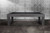 American Heritage Billiards Alta Pool Table in Marble Grey, modern pool table with sleek marble grey finish and sturdy legs against a marble wall background.