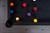American Heritage Billiards Alta Pool Table in Marble Grey, top view showing pool balls arranged on the black felt surface.