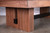 American Heritage Billiards Vancouver Slate Pool Table in Honey Ash, close-up of wooden legs and frame showing rich wood grain and modern design.