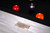 American Heritage Billiards Alta Slate Pool Table in White Wash on Ash, close-up view showing the textured white finish and a metal plaque with the brand name.