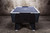 Doc & Holliday x Dynamo Pro Style Air Hockey Table, black and blue air hockey table with a sleek design on a concrete floor.