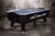 Doc & Holliday x Dynamo Pro Style Air Hockey Table, a black professional-grade air hockey table with sleek design and sturdy legs.
