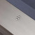 Plank & Hide Co Lexa Steel Slate Pool Table by Plank & Hide, featuring Gun Metal Finish and a close-up of sleek, modern metal logo details on the table surface.