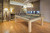 Brunswick Hickory 8' Slate Pool Table in Natural Hickory finish, set in a luxury game room. The table’s sleek design, hand-hammered metal rail sights, and premium 1" slate surface create an elegant and inviting centerpiece for any modern space. Brunswick Hickory 8' Slate Pool Table in Natural Hickory finish, set in a luxury game room. The table’s sleek design, hand-hammered metal rail sights, and premium 1" slate surface create an elegant and inviting centerpiece for any modern space.