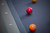 Doc & Holliday Bellano Slate Pool Table by Doc & Holliday in Matte Smoke, close-up of pool table surface with billiard balls.