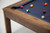 Close-up of Doc & Holliday Redford pool table Van Dyk wood grain and blue felt